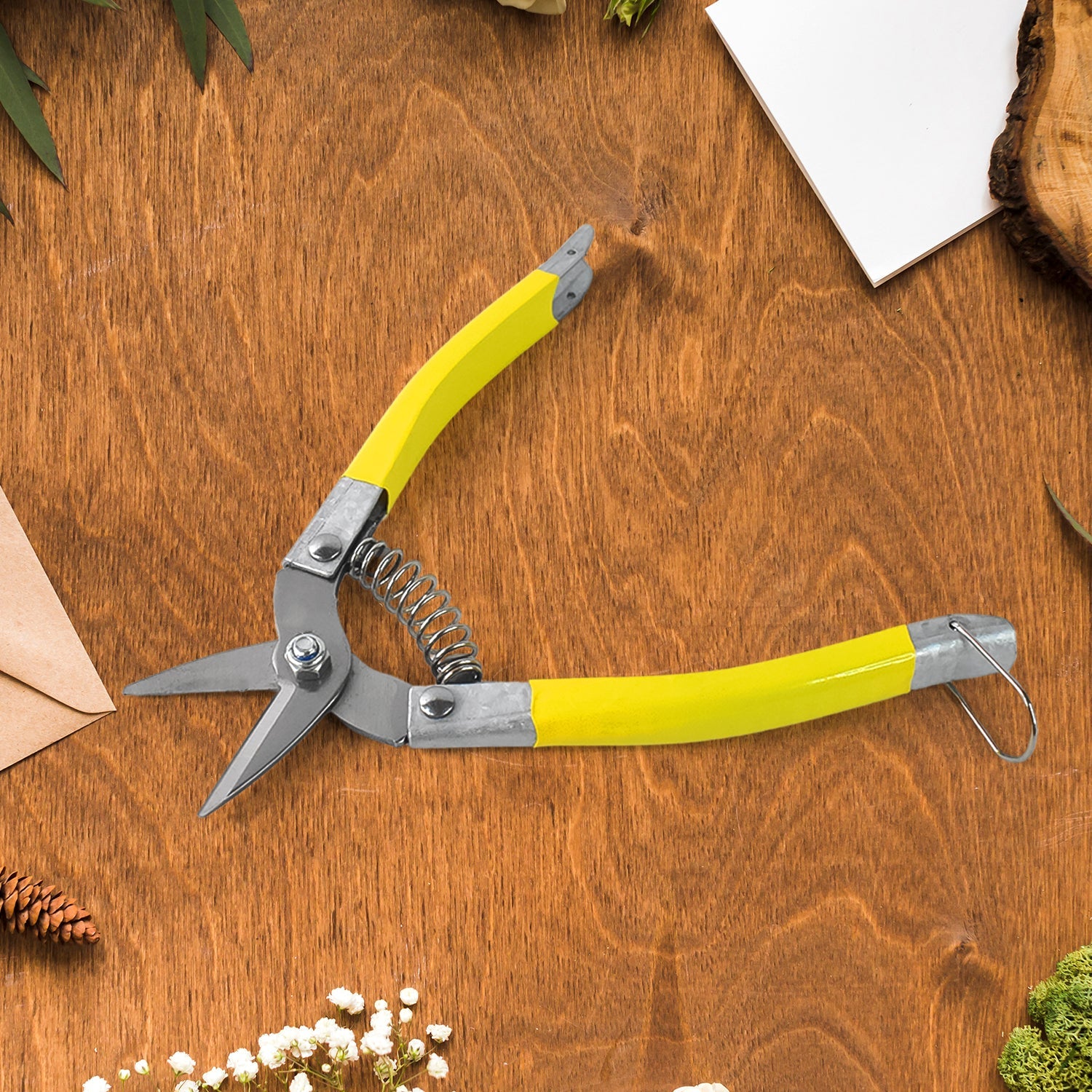 Garden snip pruning tool showing non-stick coated stainless steel blades
