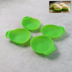 Four flexible silicone idli maker cups stacked together for compact storage