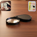 Portable handheld magnifying glass with folding protective case
