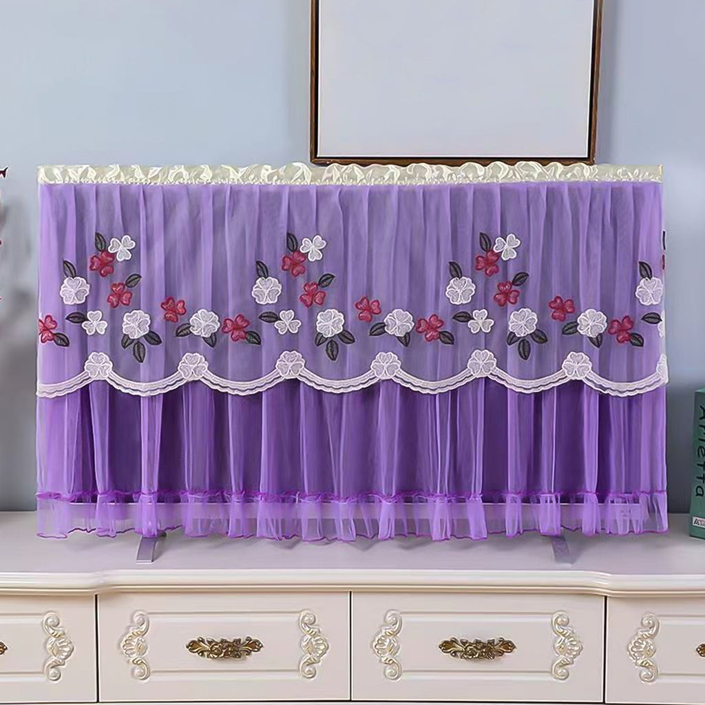 Stylish mix-color dustproof TV cover draped over a television in a home setting.