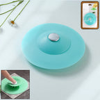 Flexible silicone sink drain cover and hair catcher strainer placed on sink drain