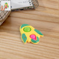 Yellow, green, and pink rocket-shaped fidget keychain toy with tactile popper bubbles