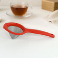 Green tea strainer with fine stainless steel mesh and red ergonomic handle