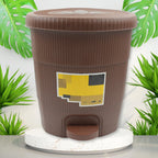 Small white pedal dustbin placed in a modern kitchen, ideal for daily use.