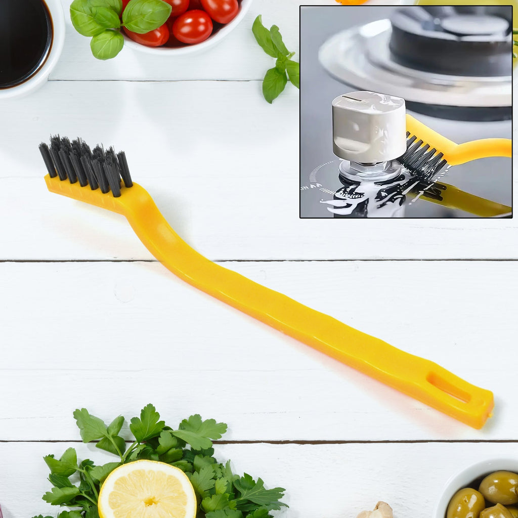 Mini nylon cleaning brush with ergonomic handle for kitchen tasks.