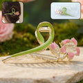 Floral hair claw clip with green leaf and pink flower design