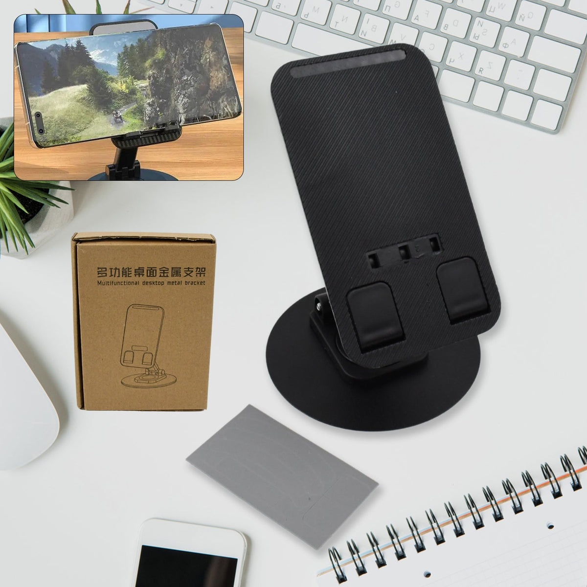 A sleek black rotating mobile stand, folded compactly on a desk, ready for use.