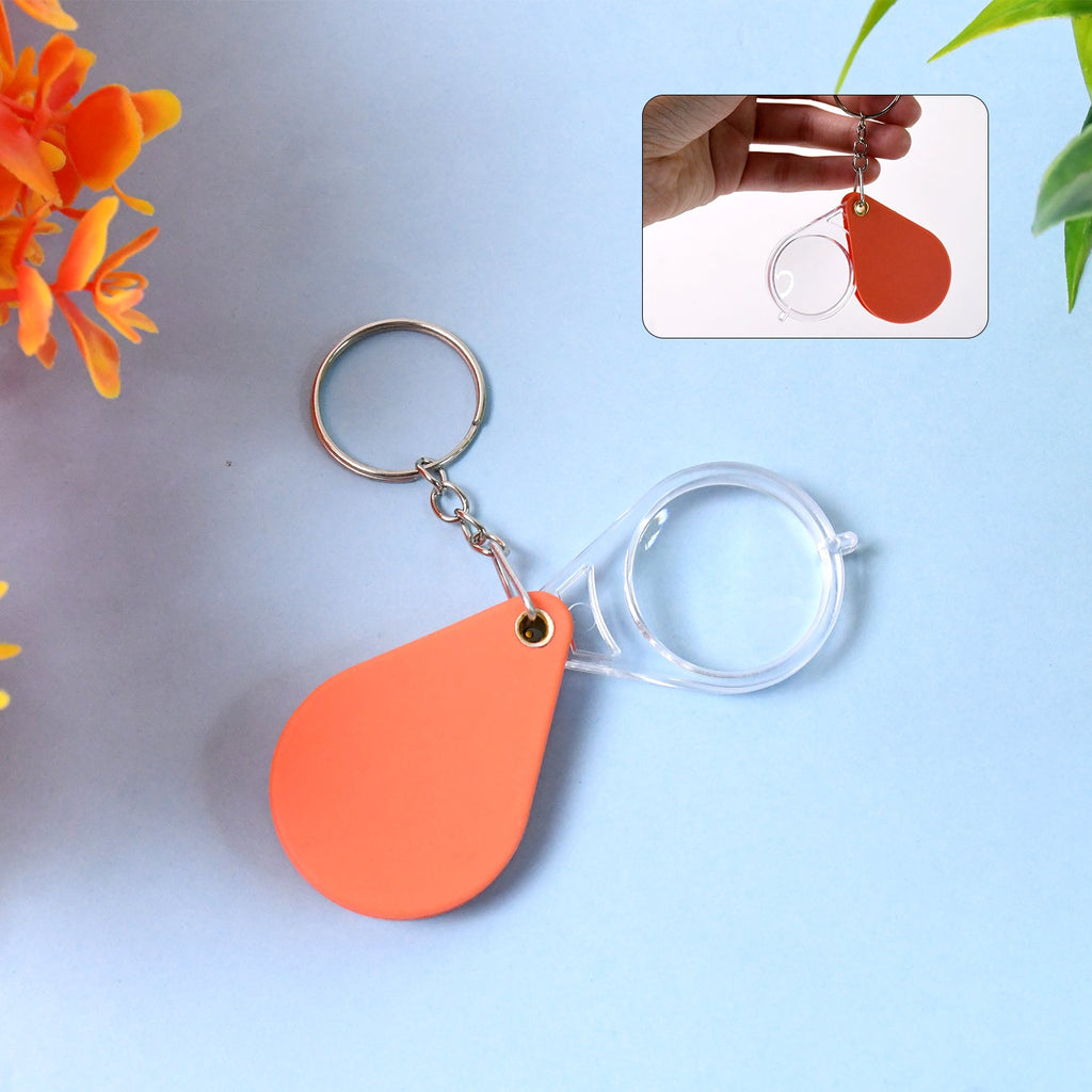 Orange portable folding magnifier keychain with clear optical glass lens