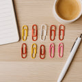 Vibrant set of vinyl-coated paper clips for document organization on a white background.