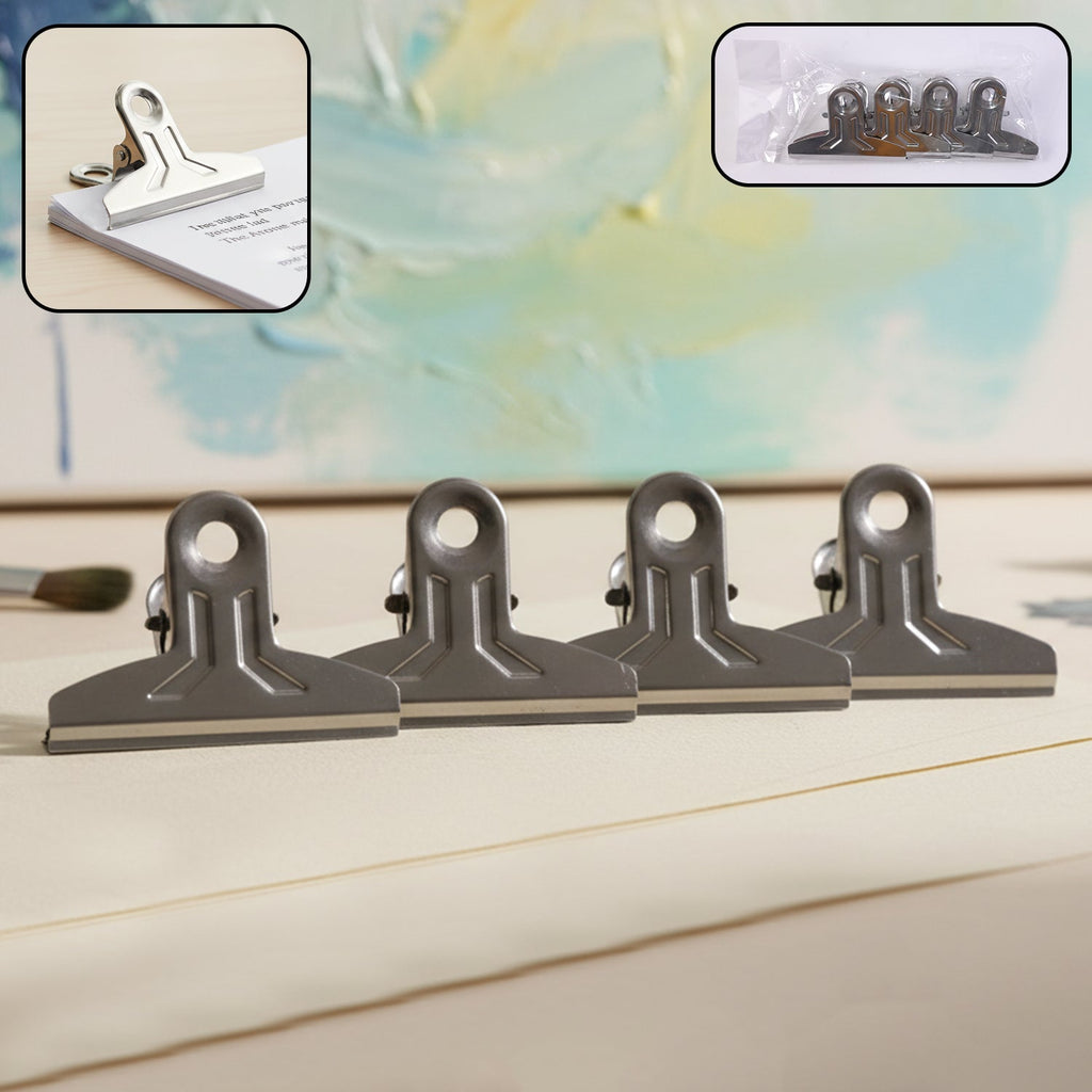 Heavy duty metal paper clamp clips holding documents tightly