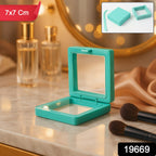 Close-up of jewellery secured inside transparent floating display box