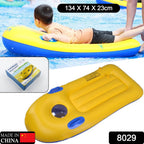 Close-up of a child on a yellow inflatable surfboard, showcasing the sturdy handles.