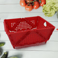 Colorful foldable storage basket with ventilation holes.