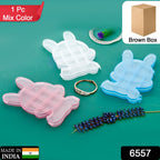 Clear bear-shaped jewelry organizer made from durable ABS plastic.