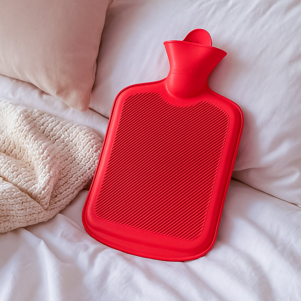 Large red rubber hot water bag providing soothing relief.