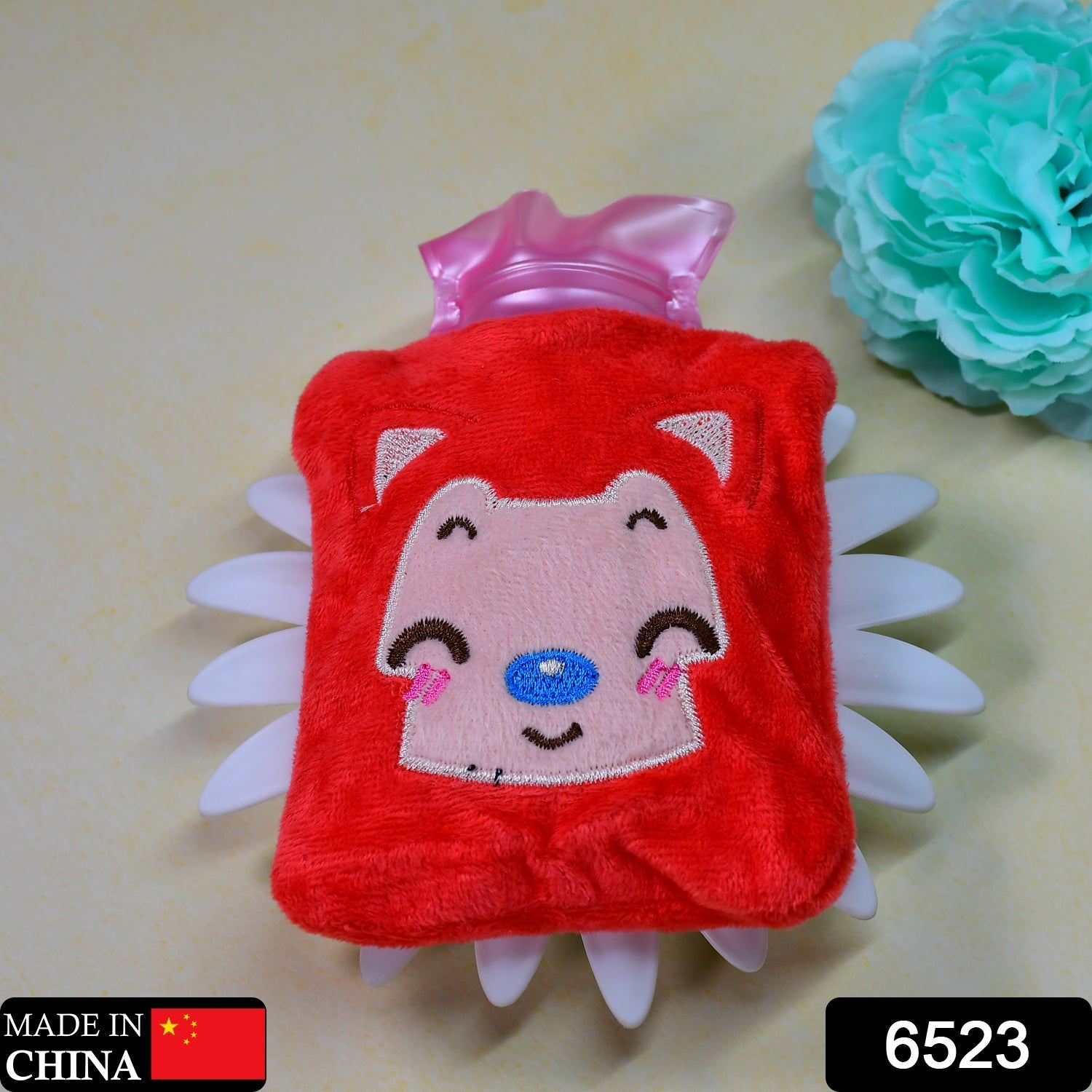 Cute pink cat hot water bag, perfect for neck and shoulder pain relief.