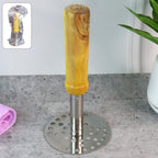 Quickslice Stainless Steel Potato Masher with ergonomic wooden handle on a kitchen counter.