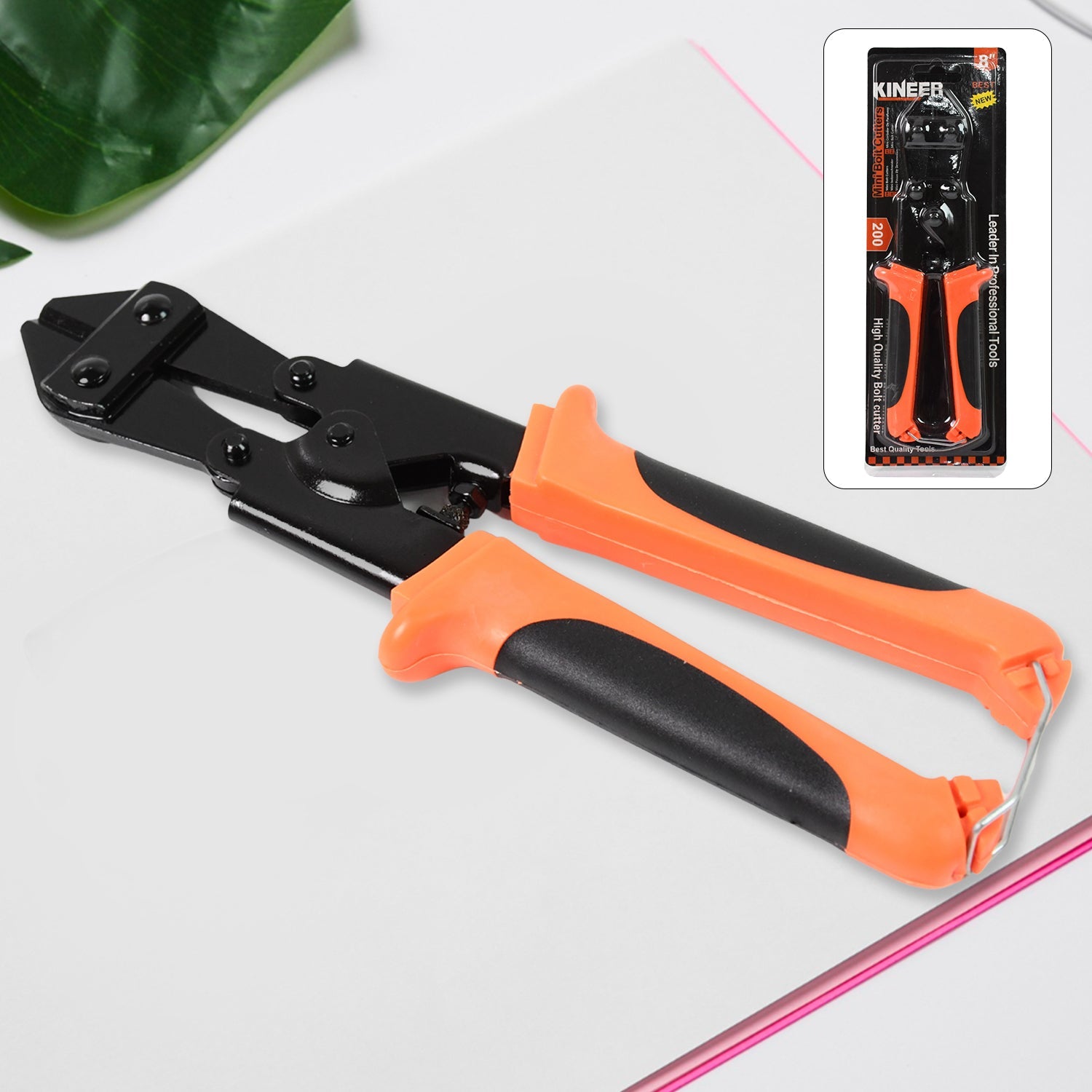 Mini bolt cutter with red and black handles on a clean background.