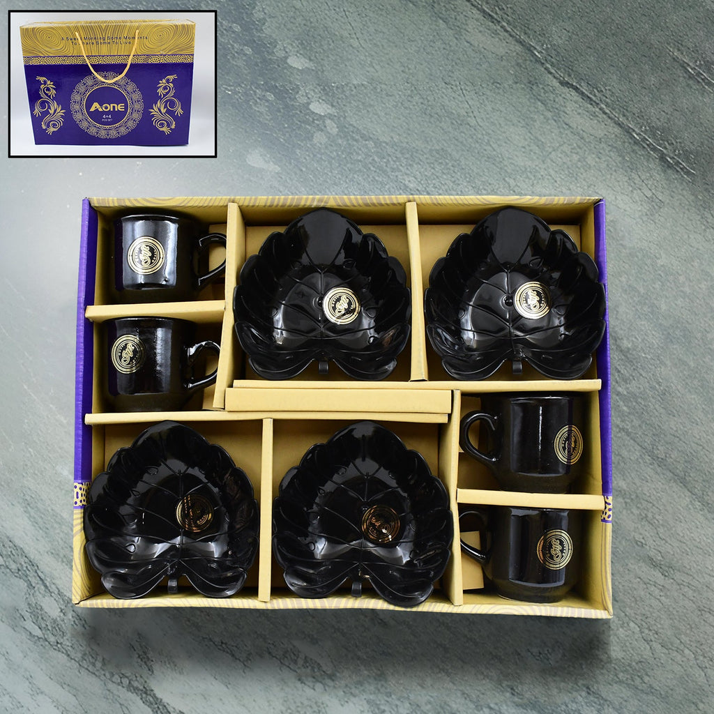 A One 8-piece ceramic tea cup set with leaf-shaped serving bowls arranged on a white surface.