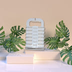 Empty collapsible laundry basket with integrated hanger hook, showcasing its design.