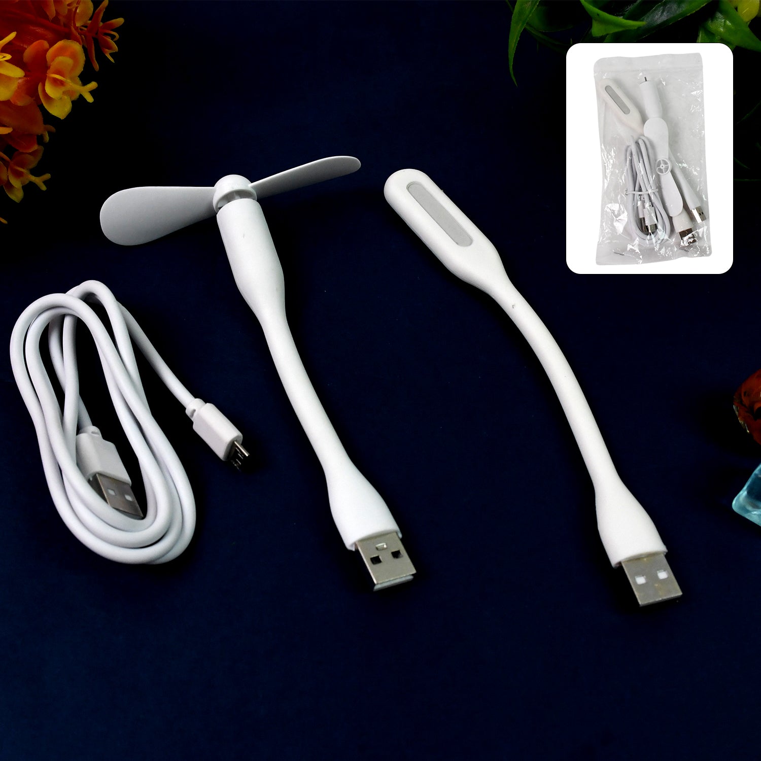 A person holding the mini USB fan, showcasing its small size and ease of handling.