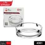 Stylish crystal glass ashtray reflecting light, ideal for any setting.