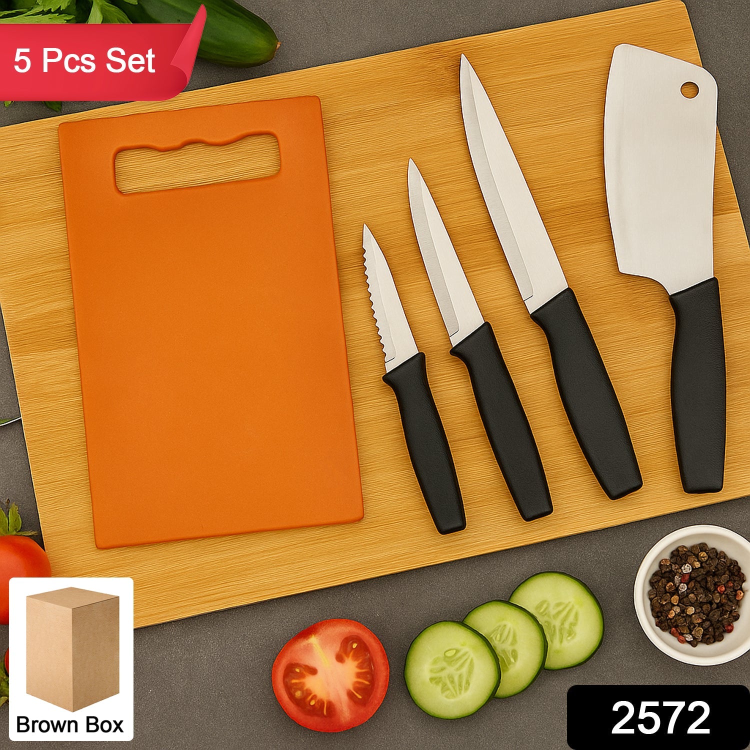Close-up of stainless steel knives and black plastic chopping board from kitchen knife set