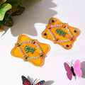 Close-up of Shubh Labh wall hanging set featuring glitter and stone embellishments