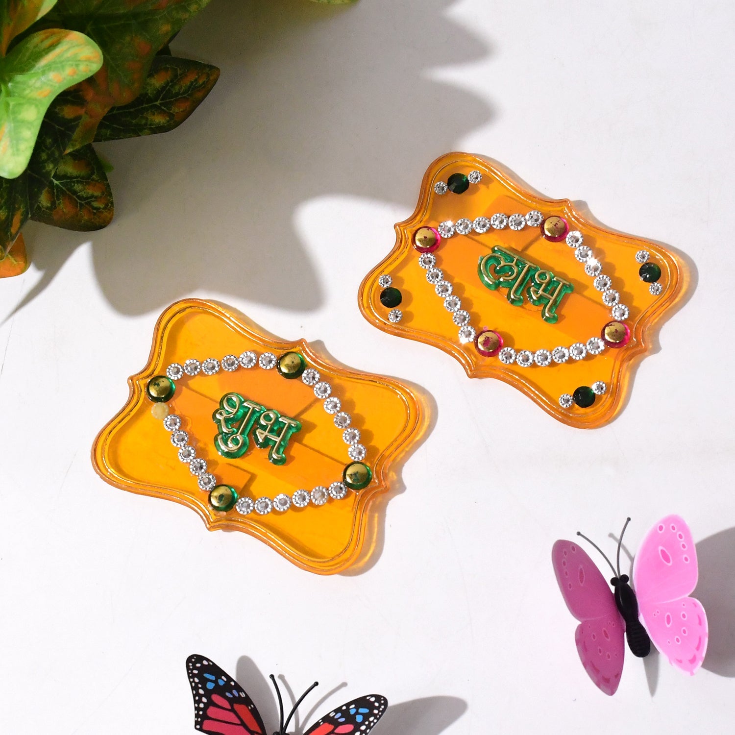 Close-up of Shubh Labh wall hanging set featuring glitter and stone embellishments