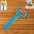 Close-up of the Y-shaped vegetable peeler, highlighting its sharp serrated blade.