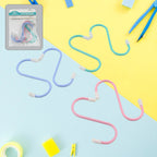 An array of items, including bags and accessories, efficiently hung with S hooks for storage.