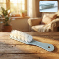 Handheld cleaning brush with soft bristles for effective household surface cleaning