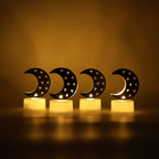 Moon shaped LED candle glowing with warm yellow light for ambient home decor