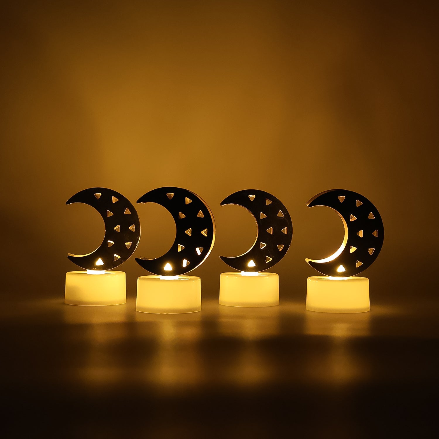 Moon shaped LED candle glowing with warm yellow light for ambient home decor