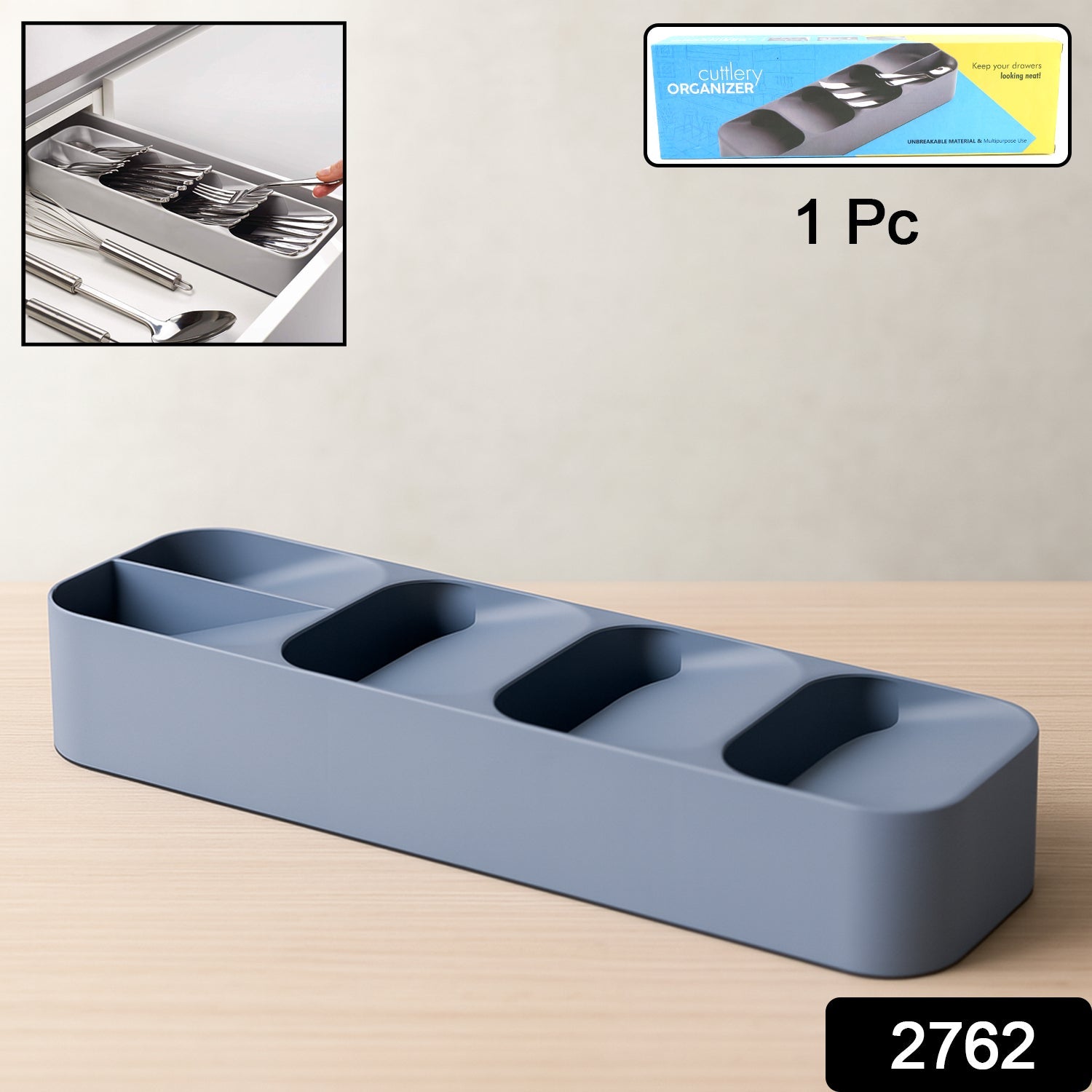 A plastic cutlery tray neatly filled with spoons, forks, and knives in a kitchen drawer.