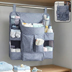 Hanging baby organizer with multiple pockets for diapers and clothes