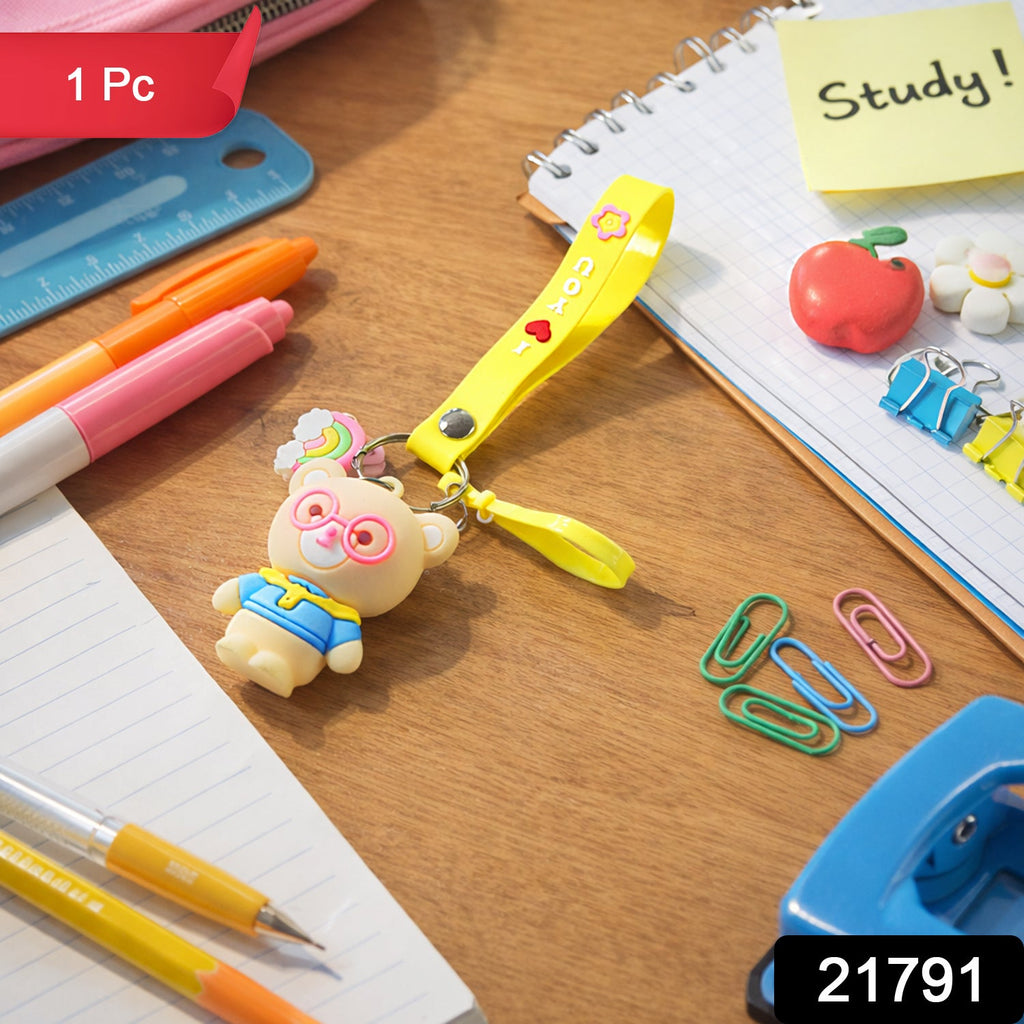 Close-up of teddy bear keychain showcasing cartoon design and vibrant yellow silicone loop strap