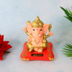 Medium Lord Ganesh Idol with solar-powered base illuminating gently on table