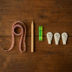 Complete 6-in-1 wall hanging measurement tool kit laid out on table
