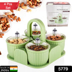 Transparent plastic snack containers filled with dry fruits and cookies.