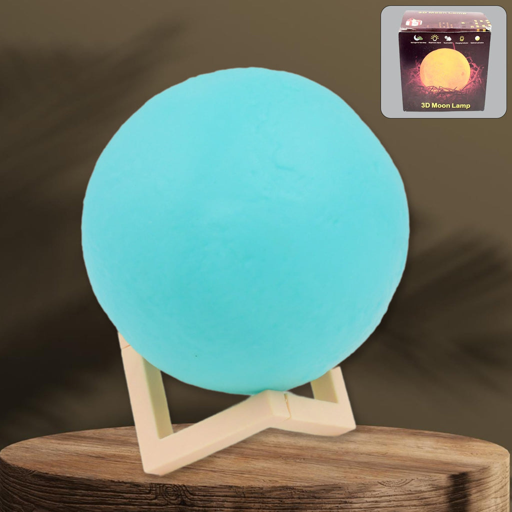 A serene blue Moon Night Lamp illuminating a dark room, creating a calming ambiance.