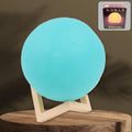 A serene blue Moon Night Lamp illuminating a dark room, creating a calming ambiance.