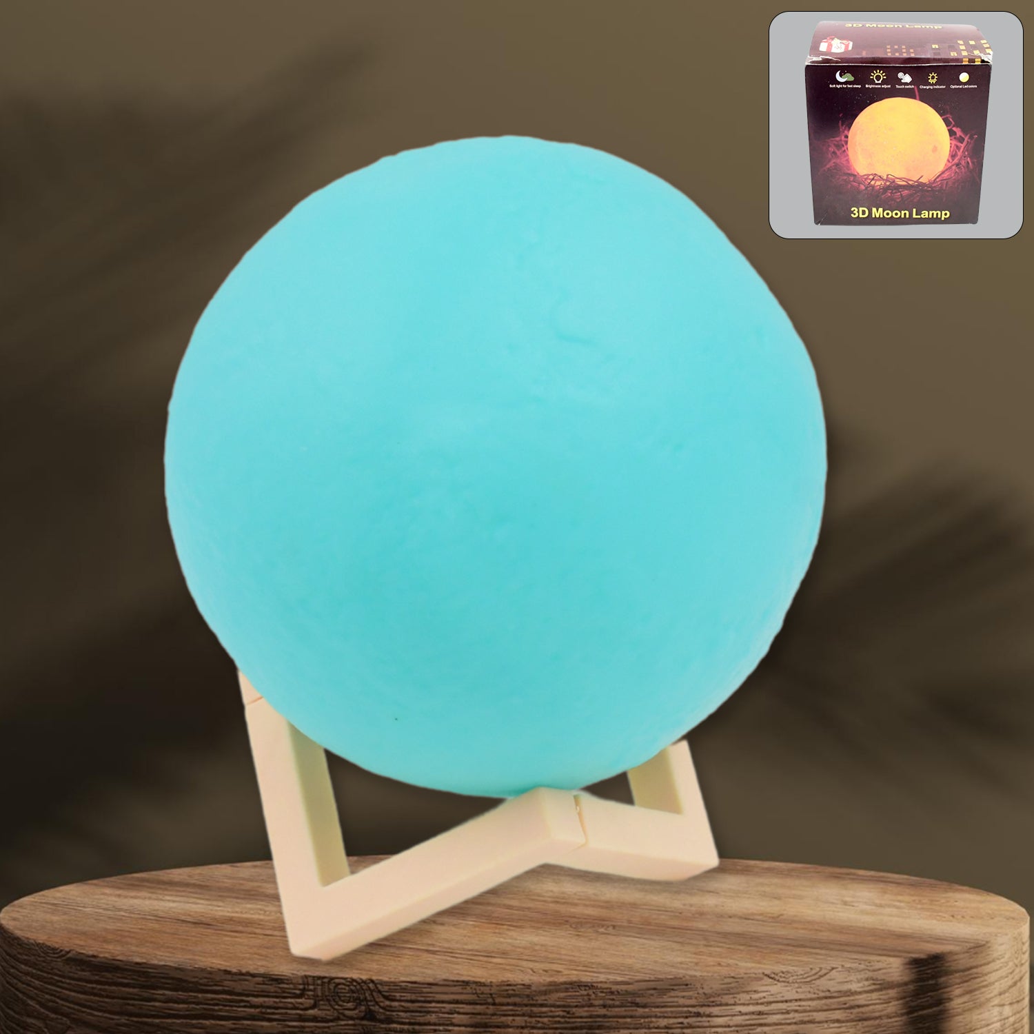 A serene blue Moon Night Lamp illuminating a dark room, creating a calming ambiance.