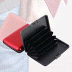 JourneyMate waterproof card holder in sleek black, closed for secure storage.