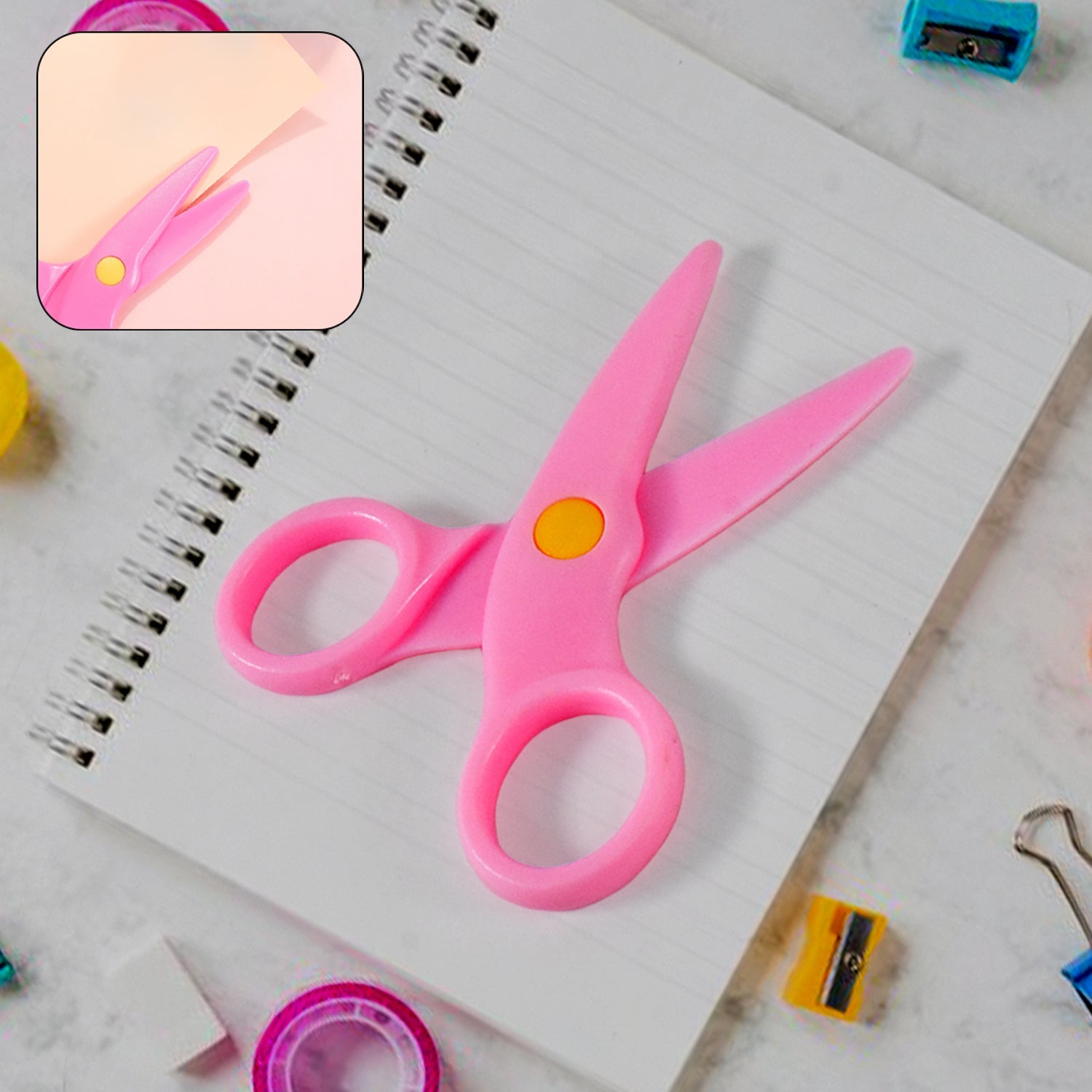 Set of colourful child-safe plastic scissors for toddlers learning to cut.