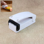 Mini heat sealer sealing a plastic snack bag airtight