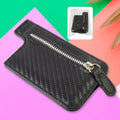 Black adhesive phone card holder attached to a smartphone, showcasing its sleek design.