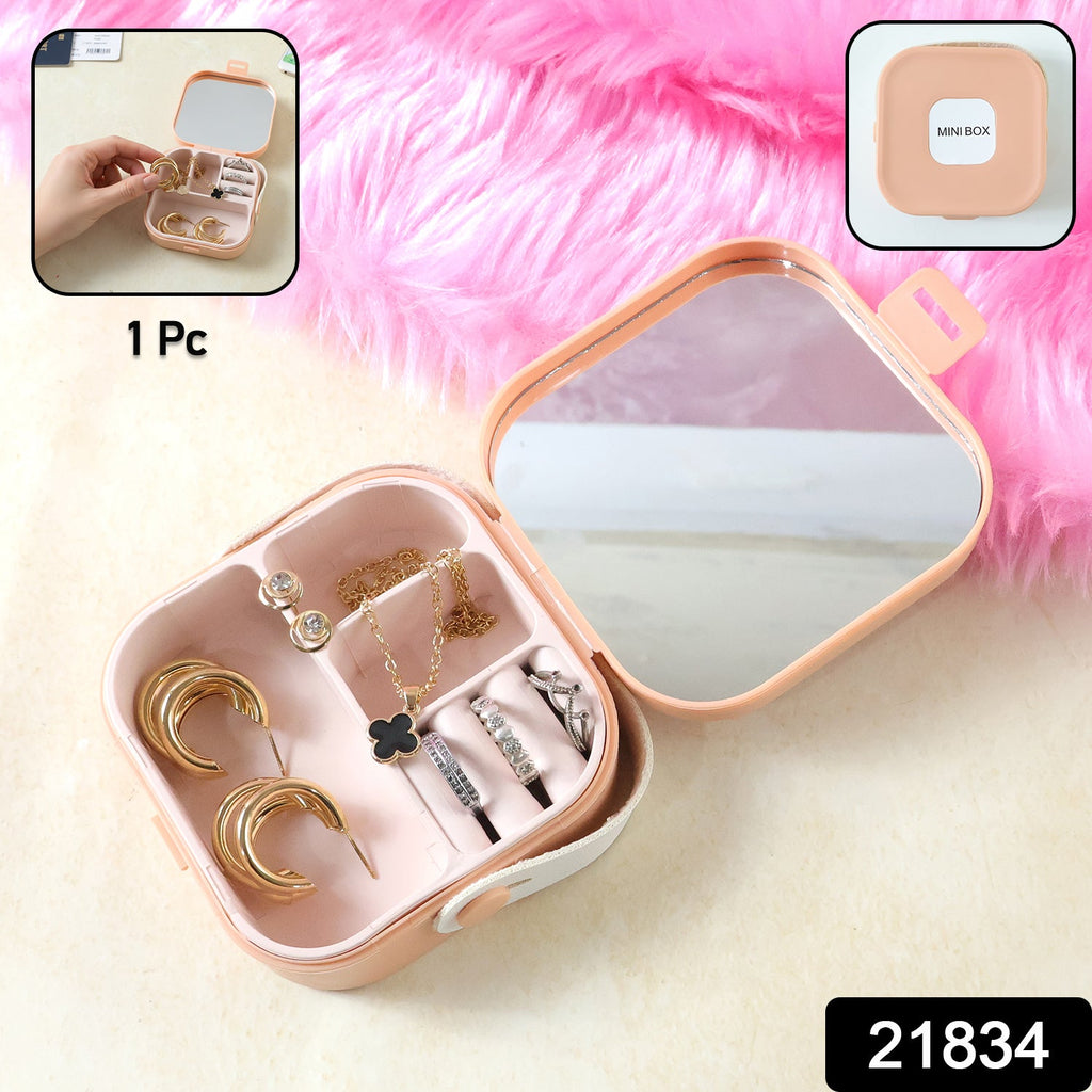 Open mini jewelry organizer with mirror and multiple compartments