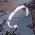 Minimalist silver-tone stainless steel bracelet with open-ended design