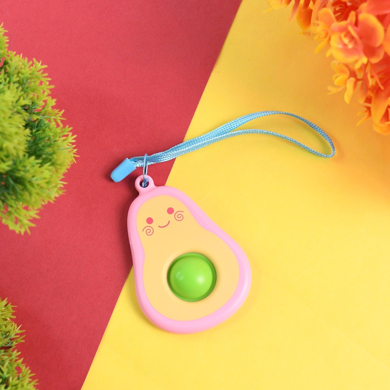 Smiley faced avocado push pop keychain with silicone bubble